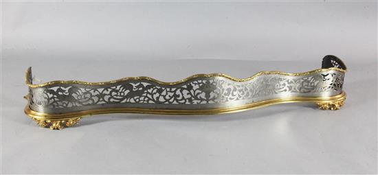 A Victorian gilt brass and steel serpentine fender, W.4ft 8in.